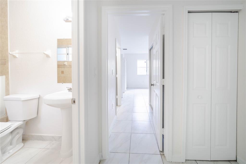 845 Southwest 6th Court Homestead, FL 33034 - Photo 19 of 30 a bathroom with a glass door shower