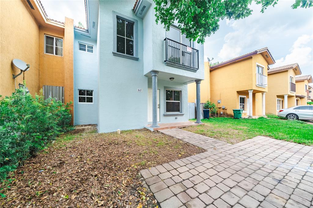 845 Southwest 6th Court Homestead, FL 33034 - Photo 2 of 30 a view of a street with brick building in front of it