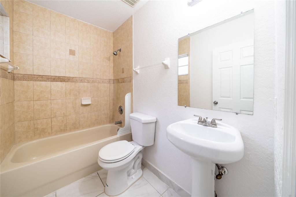 845 Southwest 6th Court Homestead, FL 33034 - Photo 21 of 30 a bathroom with a sink a toilet and shower