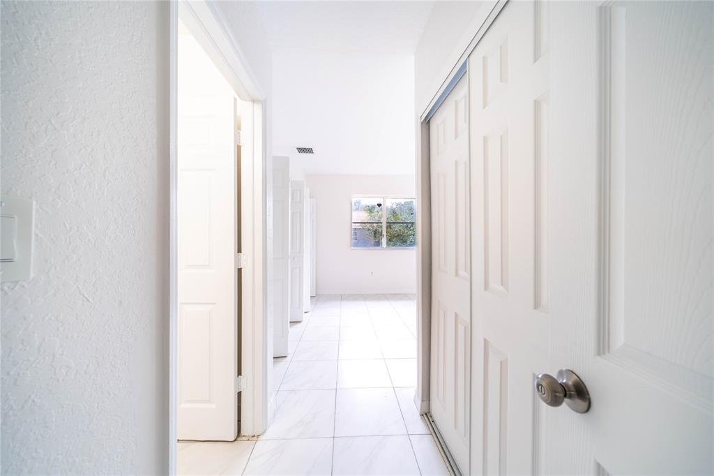 845 Southwest 6th Court Homestead, FL 33034 - Photo 26 of 30 a view of a bathroom from a hallway