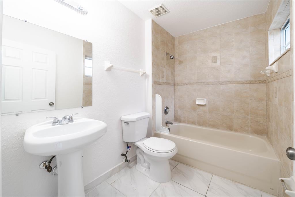 845 Southwest 6th Court Homestead, FL 33034 - Photo 27 of 30 a bathroom with a sink toilet and shower