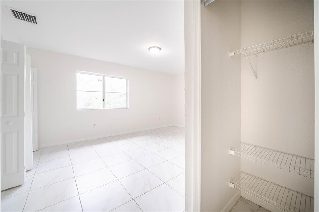 845 Southwest 6th Court Homestead, FL 33034 - Photo 28 of 30 a view of an empty room with a window