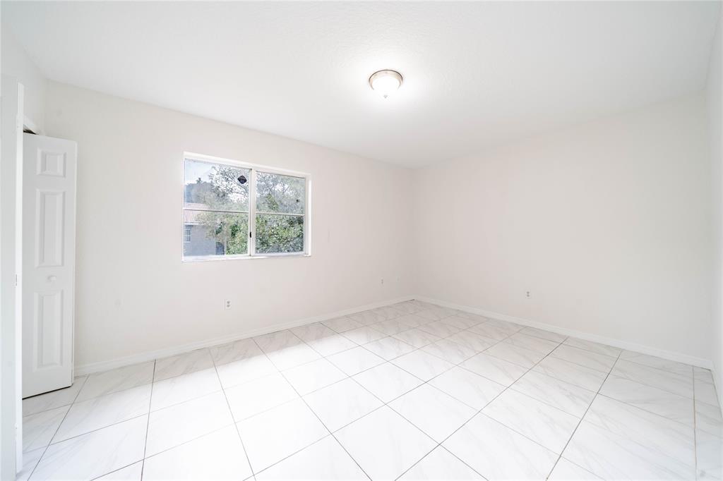 845 Southwest 6th Court Homestead, FL 33034 - Photo 29 of 30 an empty room with a window