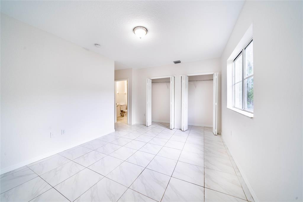 845 Southwest 6th Court Homestead, FL 33034 - Photo 30 of 30 a view of an empty room with window and cabinet