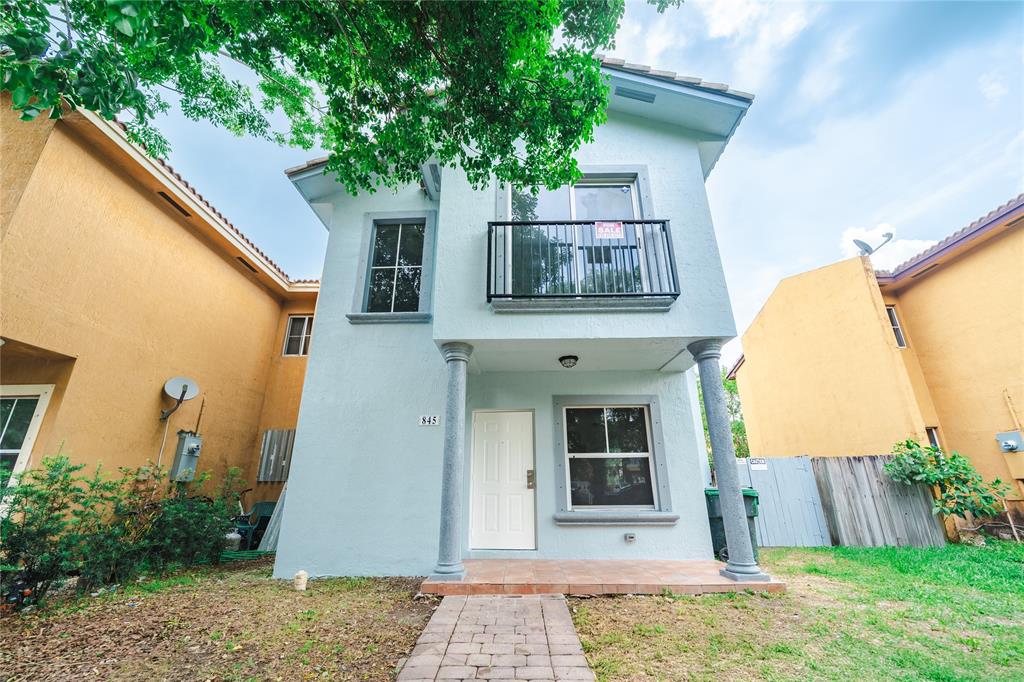 845 Southwest 6th Court Homestead, FL 33034 - Photo 3 of 30 a front view of a house with garden