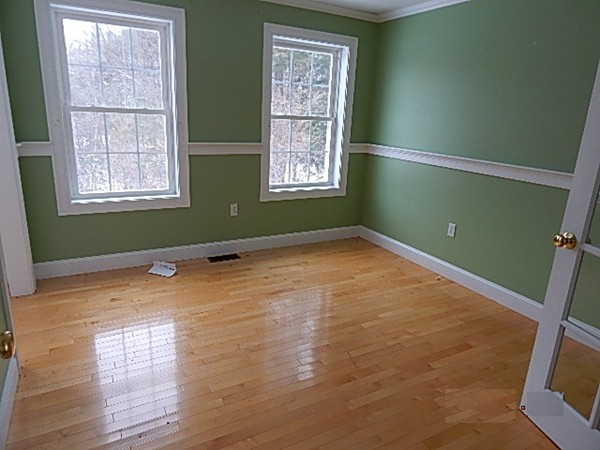 78 Miles Road Athol, MA 01331 - Photo 5 of 11 a view of empty room with window and wooden floor