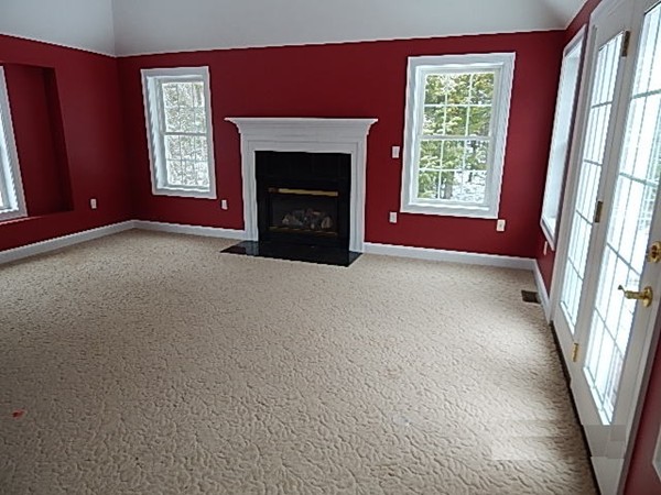 78 Miles Road Athol, MA 01331 - Photo 6 of 11 an empty room with windows fireplace and bathroom