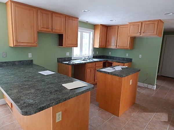 78 Miles Road Athol, MA 01331 - Photo 8 of 11 a kitchen with stainless steel appliances granite countertop a stove a sink and a microwave