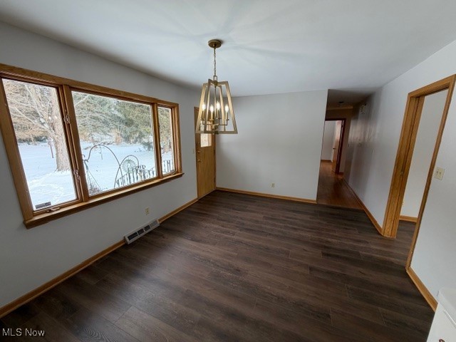 1933 Arndale Road Stow, OH 44224 - Photo 13 of 21 Unfurnished dining area featuring dark wood-style flooring and a chandelier