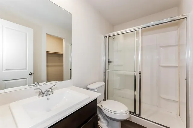 an empty room with wooden floor