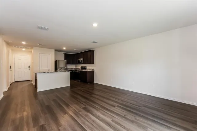 a view of kitchen with wooden floor