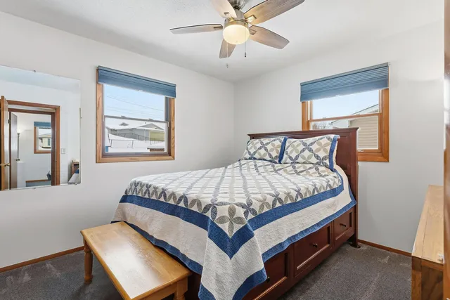 a bedroom with a bed and window