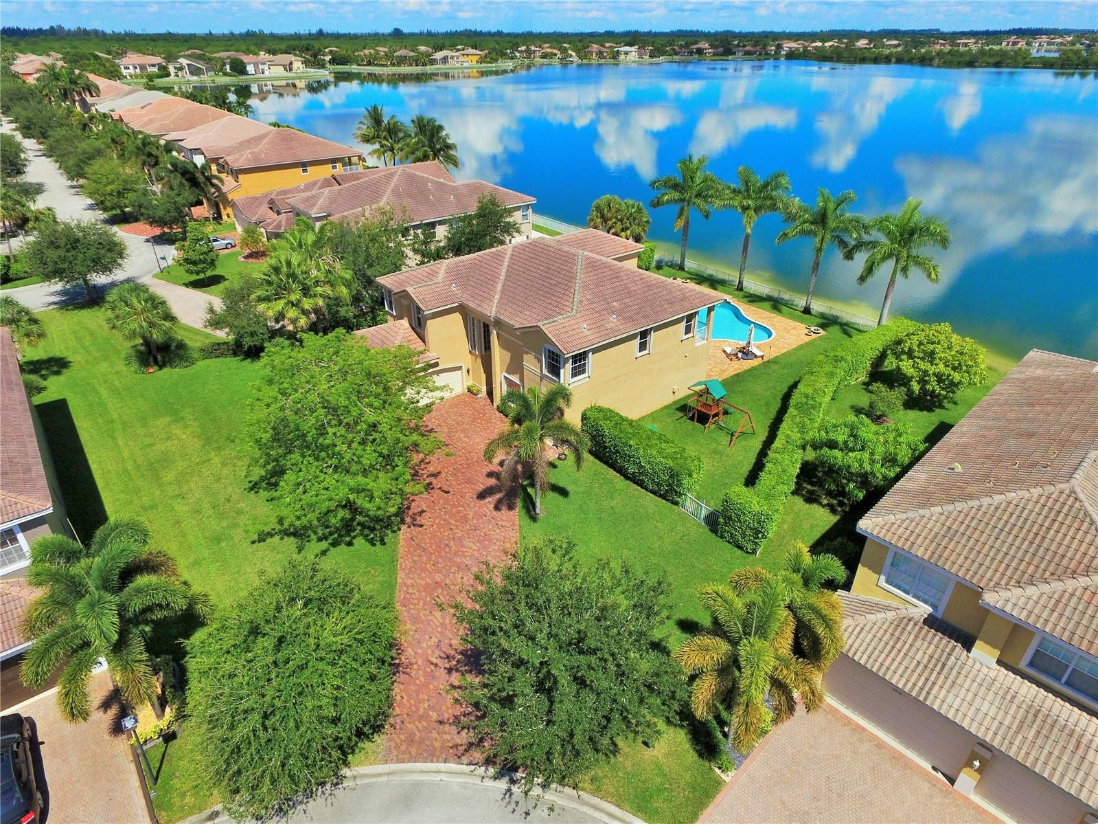 5436 Southwest 191st Terrace Miramar, FL 33029 - Photo 1 of 25 an aerial view of a house with a yard and lake view