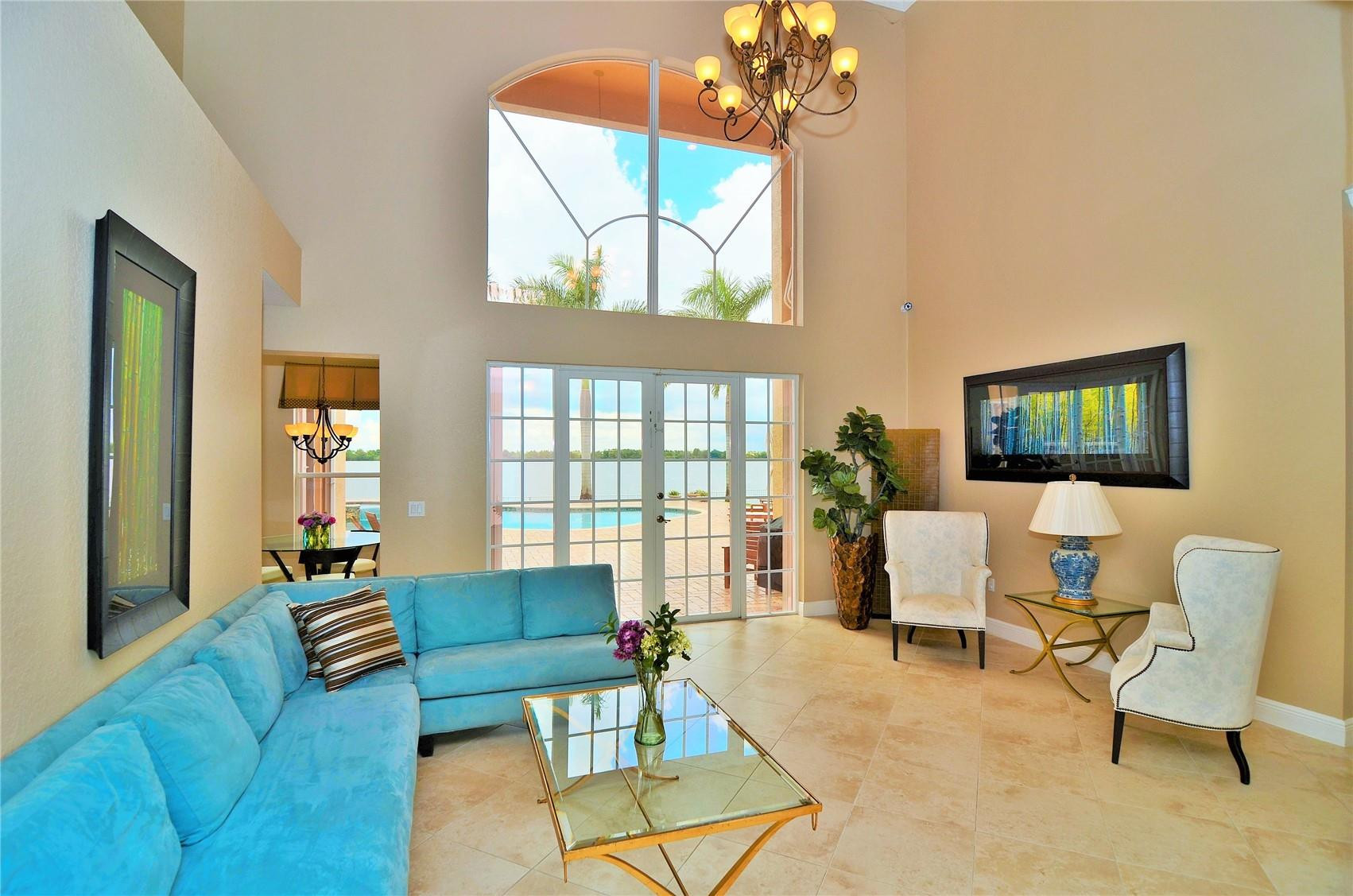5436 Southwest 191st Terrace Miramar, FL 33029 - Photo 11 of 25 a living room with furniture and a flat screen tv