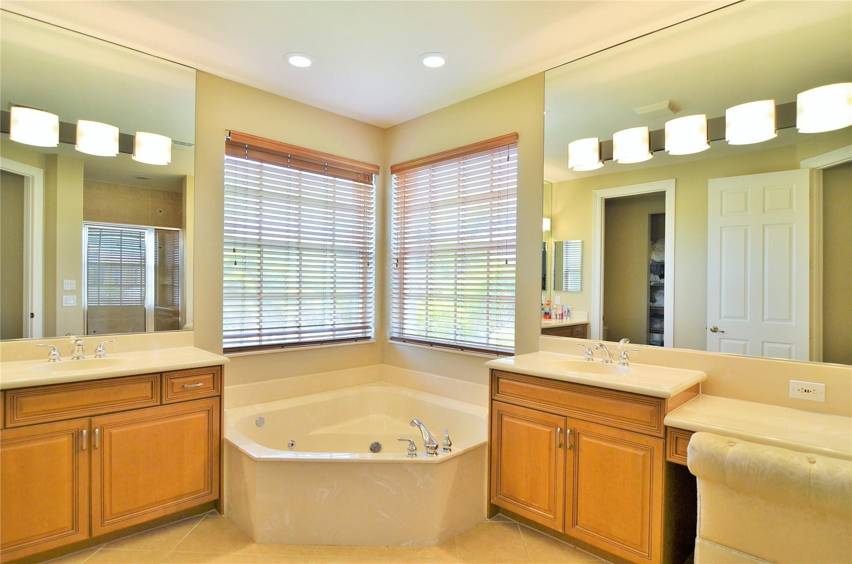 5436 Southwest 191st Terrace Miramar, FL 33029 - Photo 14 of 25 a bathroom with a granite countertop sink and a bathtub