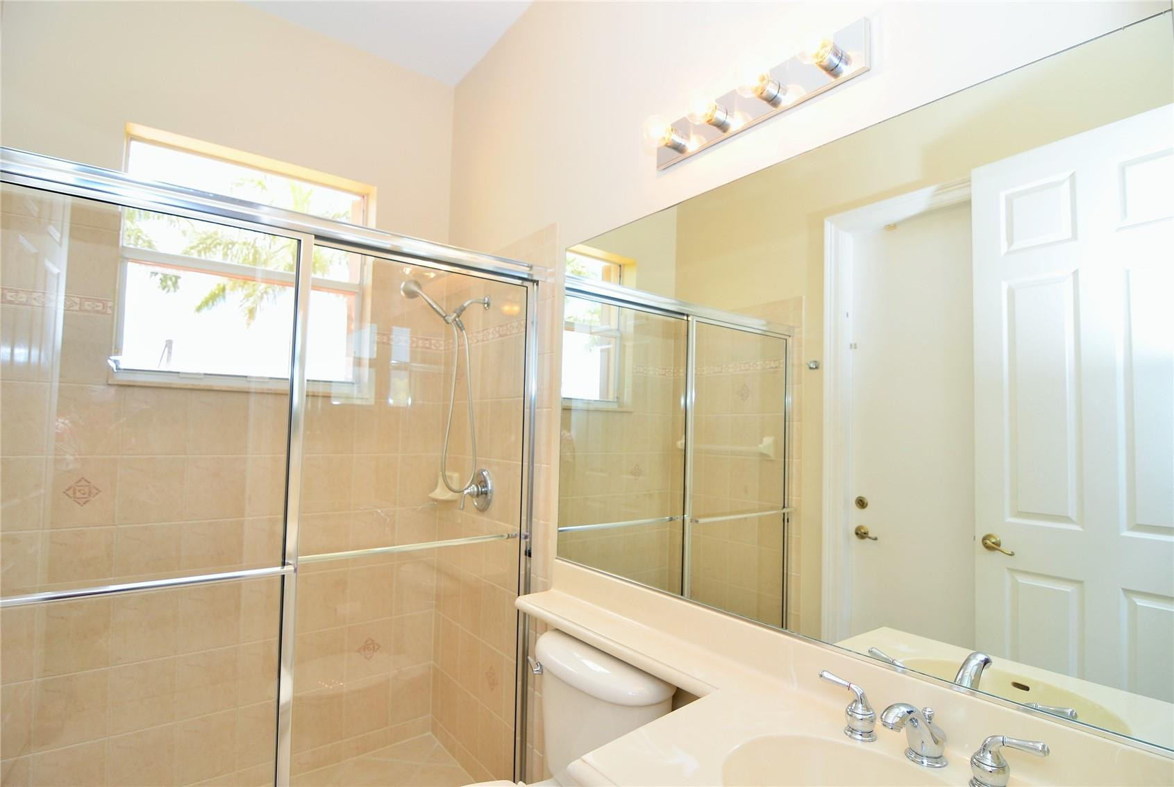 5436 Southwest 191st Terrace Miramar, FL 33029 - Photo 16 of 25 a bathroom with a sink and a shower