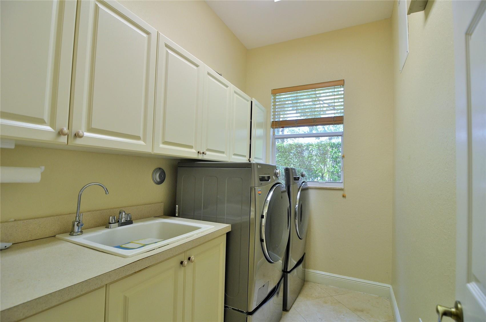 5436 Southwest 191st Terrace Miramar, FL 33029 - Photo 21 of 25 a utility room with dryer and washer