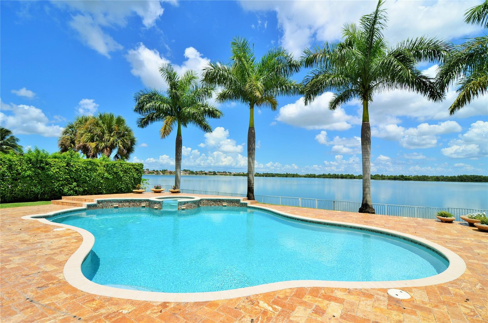 5436 Southwest 191st Terrace Miramar, FL 33029 - Photo 23 of 25 a view of swimming pool with a table and chairs