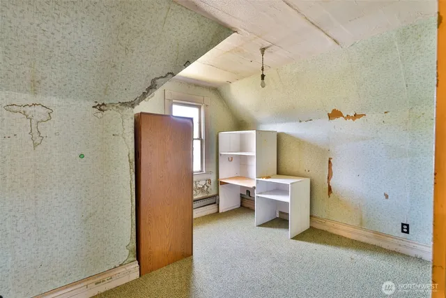 a view of entryway with wooden floor and stairs