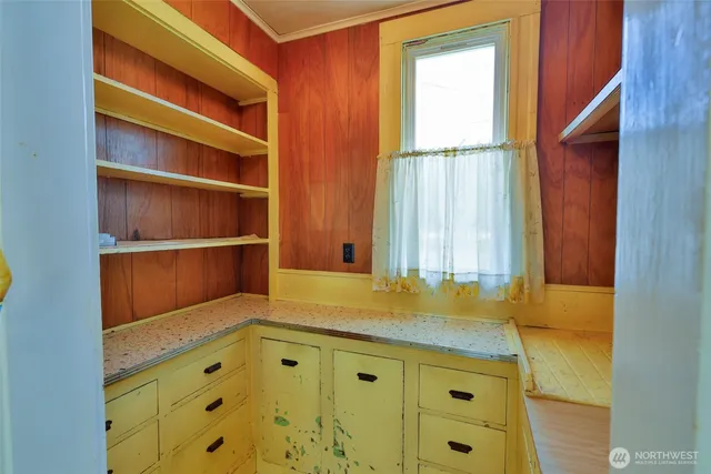 a bathroom with a tub sink and window