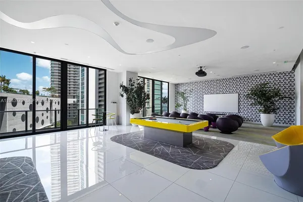 a view of a swimming pool with furniture