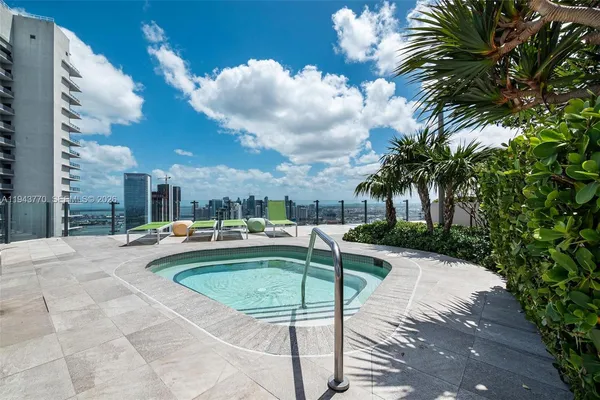 a view of a patio with swimming pool
