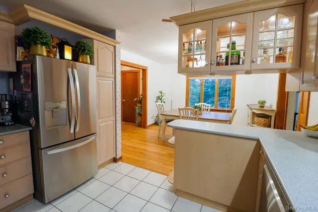 a kitchen with stainless steel appliances a refrigerator and a sink