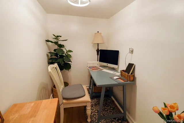 a workspace with furniture and wooden floor