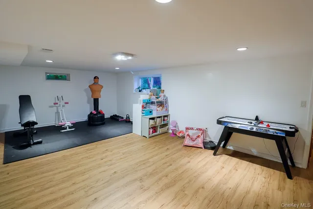 a bedroom with furniture and a wooden floor