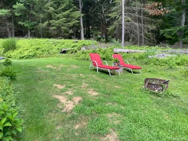 a backyard of a house with seating space