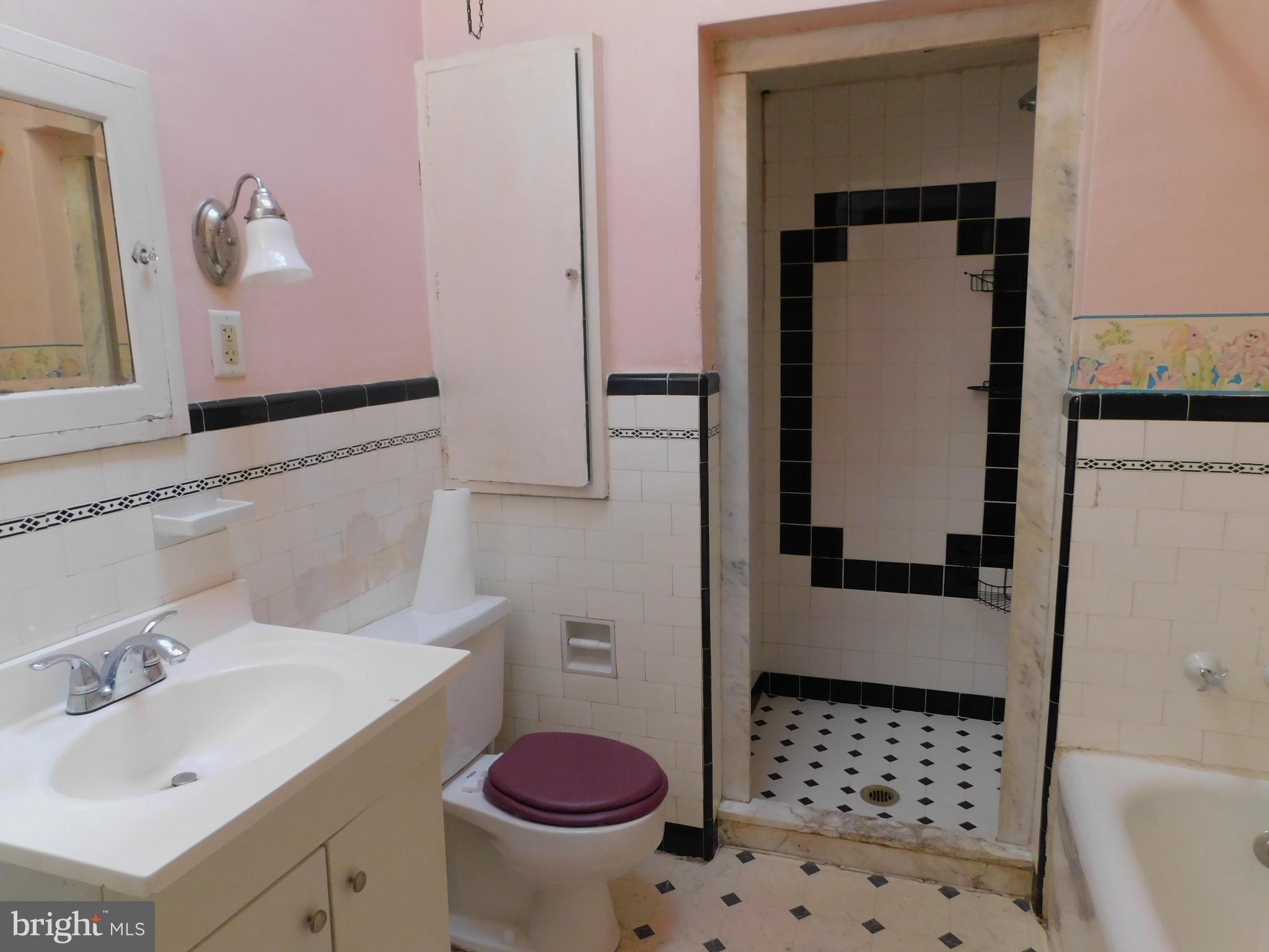 229 Huntley Road Upper Darby, PA 19082 - Photo 15 of 17 a bathroom with a sink toilet and shower