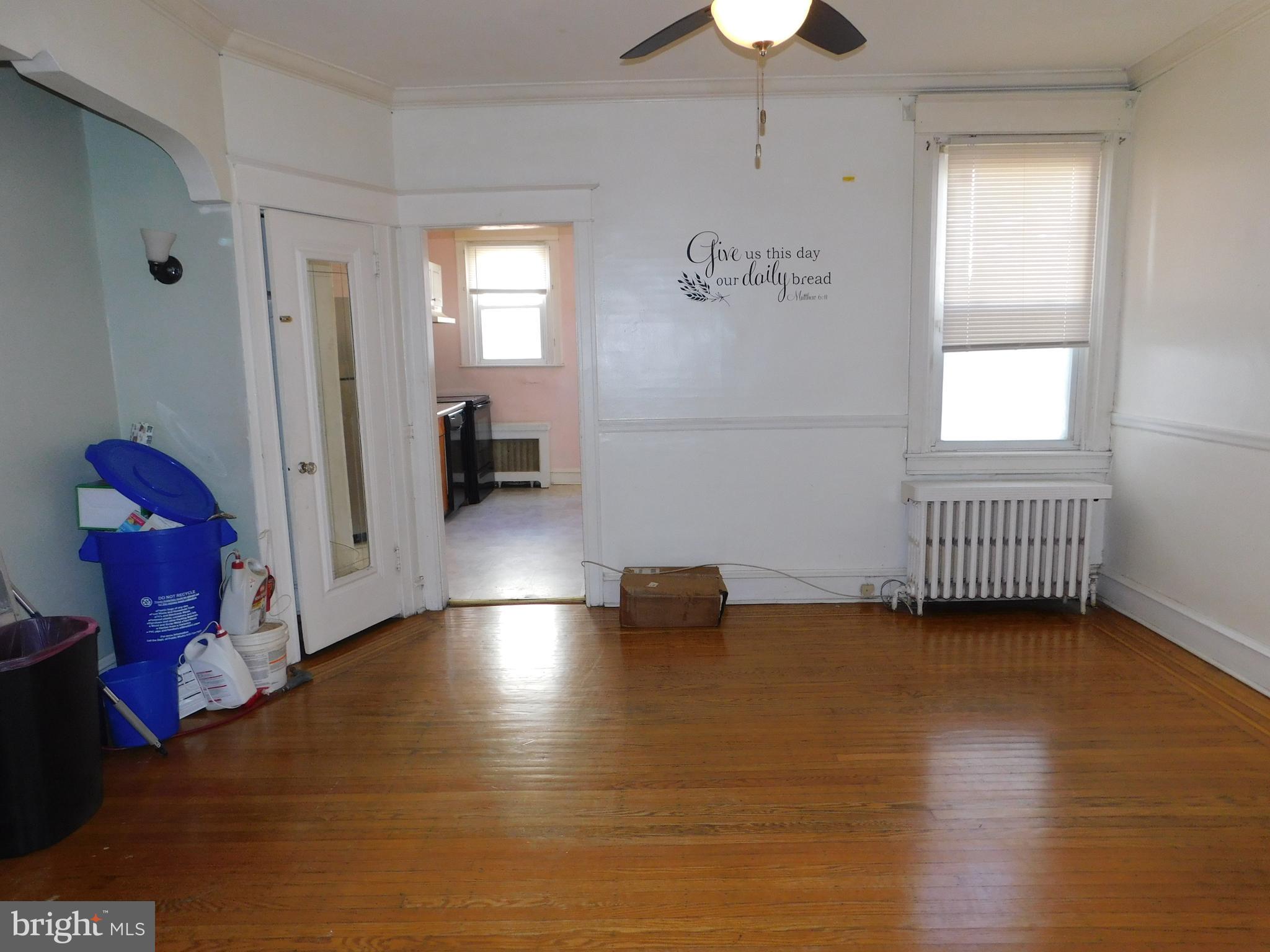 229 Huntley Road Upper Darby, PA 19082 - Photo 4 of 17 a view of empty room with wooden floor and fan