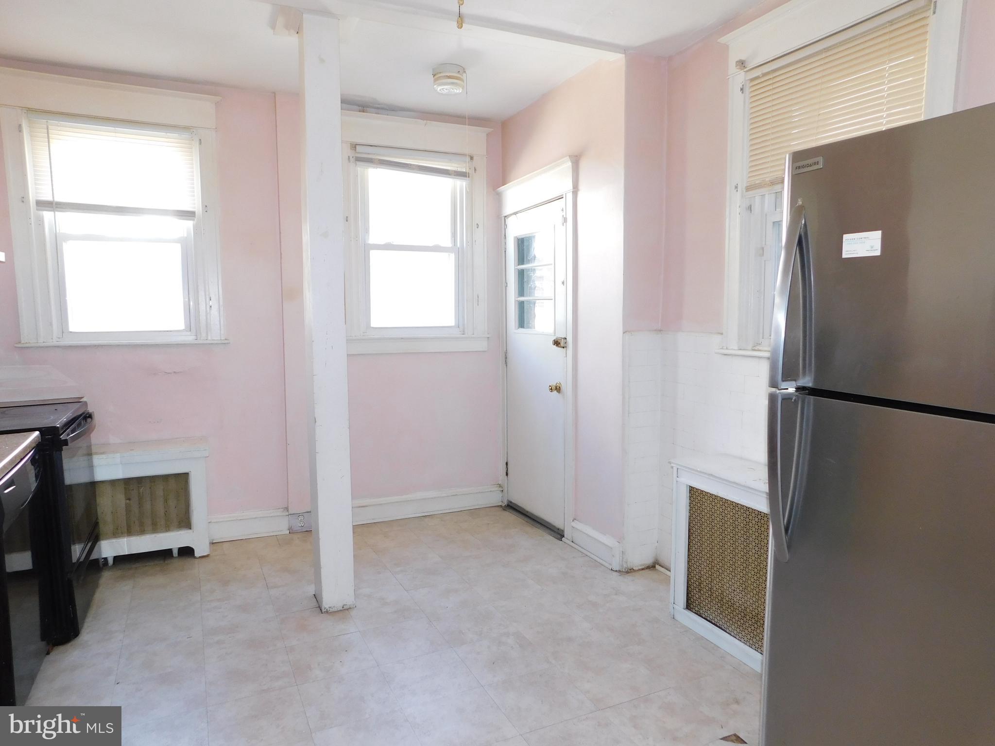 229 Huntley Road Upper Darby, PA 19082 - Photo 6 of 17 a view of an empty room with a window
