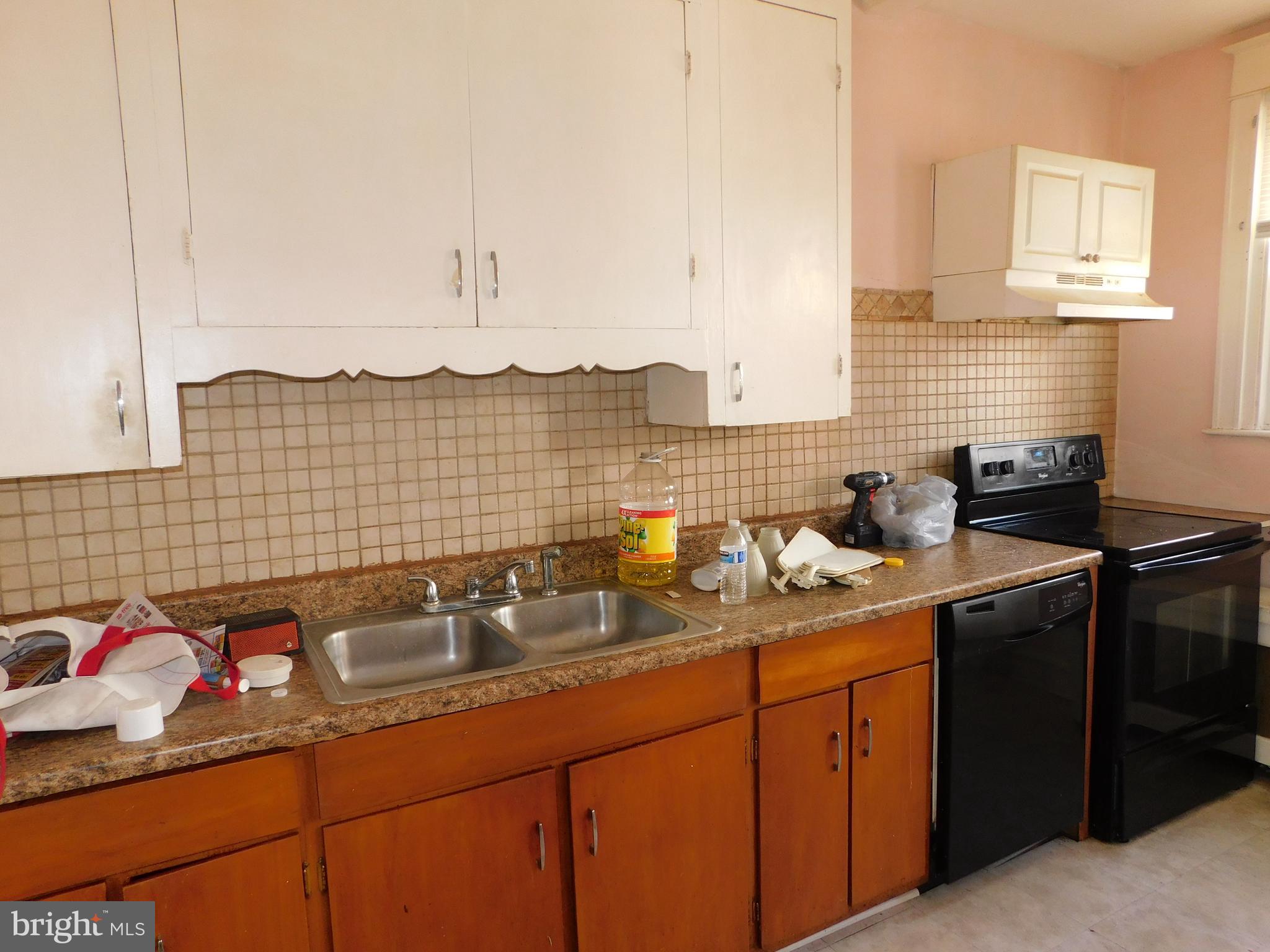 229 Huntley Road Upper Darby, PA 19082 - Photo 8 of 17 a kitchen with a sink and cabinets