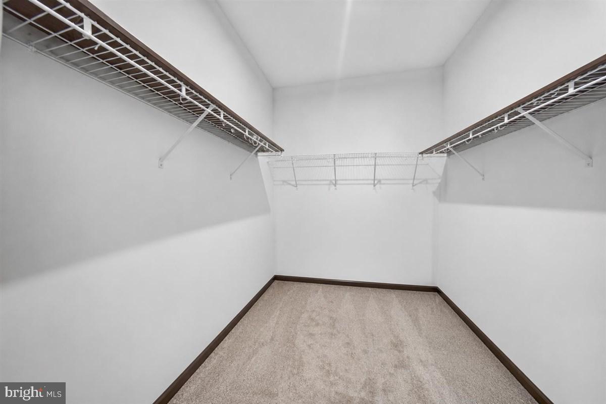 1426 Whispering Woods Road Middletown, DE 19709 - Photo 22 of 37 a view of a room with racks on the wall