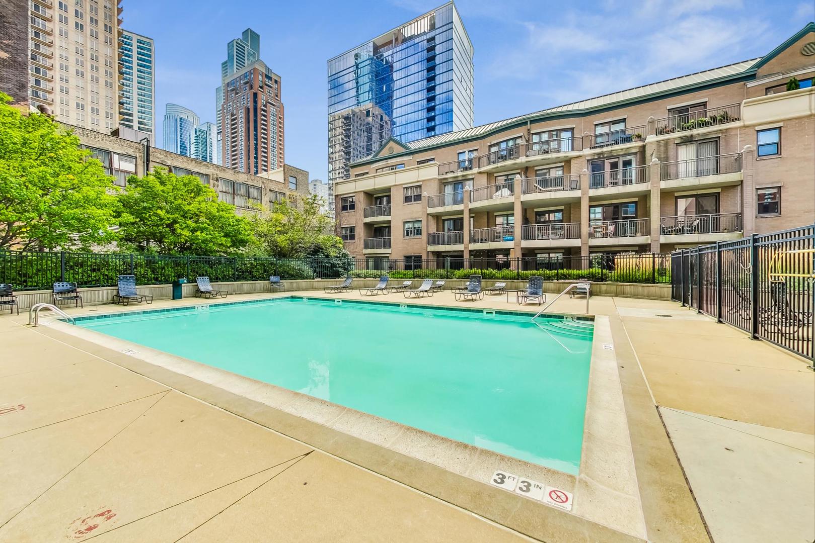 1155 South State Street, Unit C404 Chicago, IL 60605 - Photo 15 of 18 a front view of a building with swimming pool