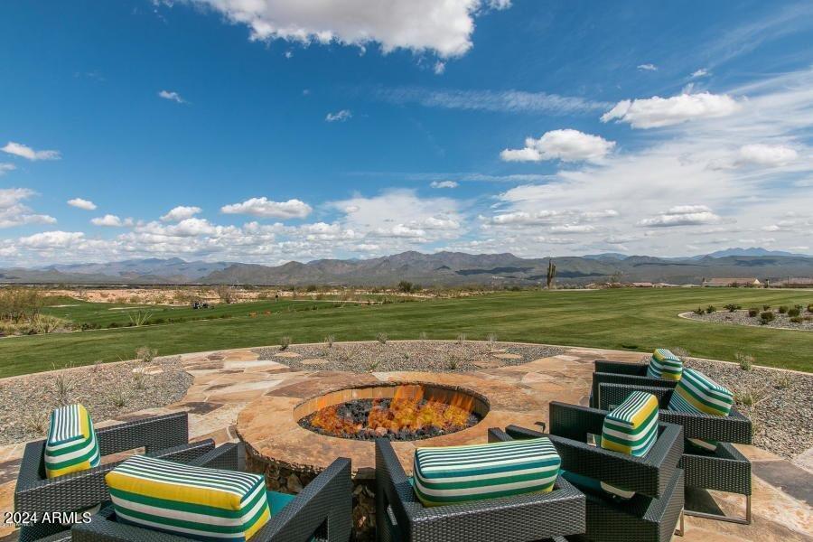 17674 East Fort Verde Road Rio Verde, AZ 85263 - Photo 39 of 42 a view of a lake with couches in the patio