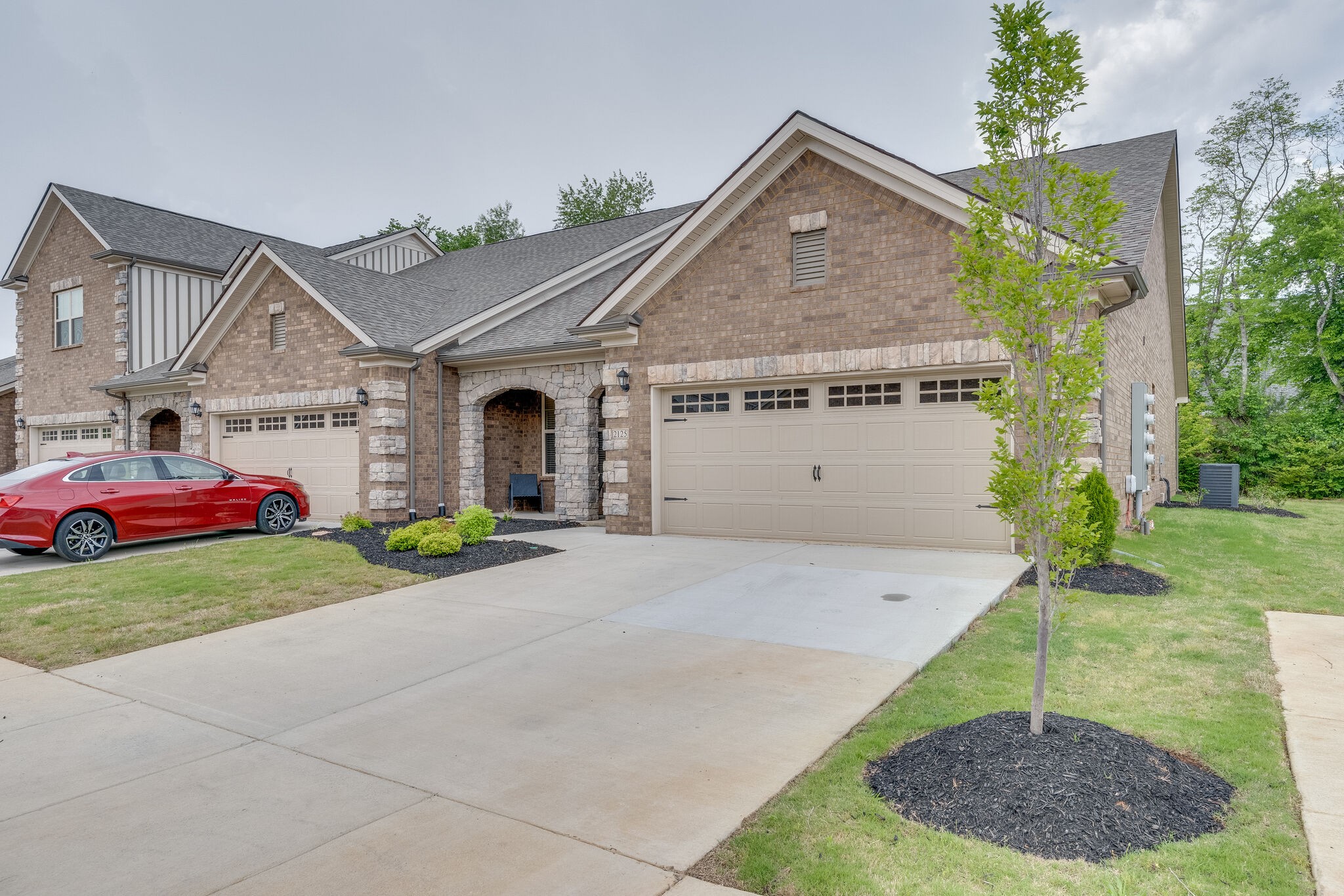 2125 Halfmoon Way Murfreesboro, TN 37130 - Photo 2 of 33 a front view of a house with a yard and garage