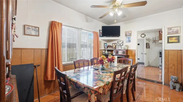 a kitchen with stainless steel appliances a stove a sink and a refrigerator