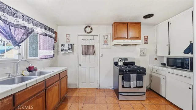 a bedroom with a bed and a dresser in it