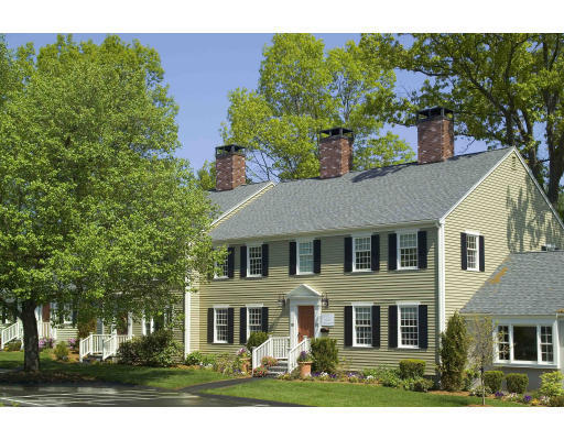 31 Jericho Road, Unit 66 Weston, MA 02493 - Photo 1 of 3 a front view of a house with a yard