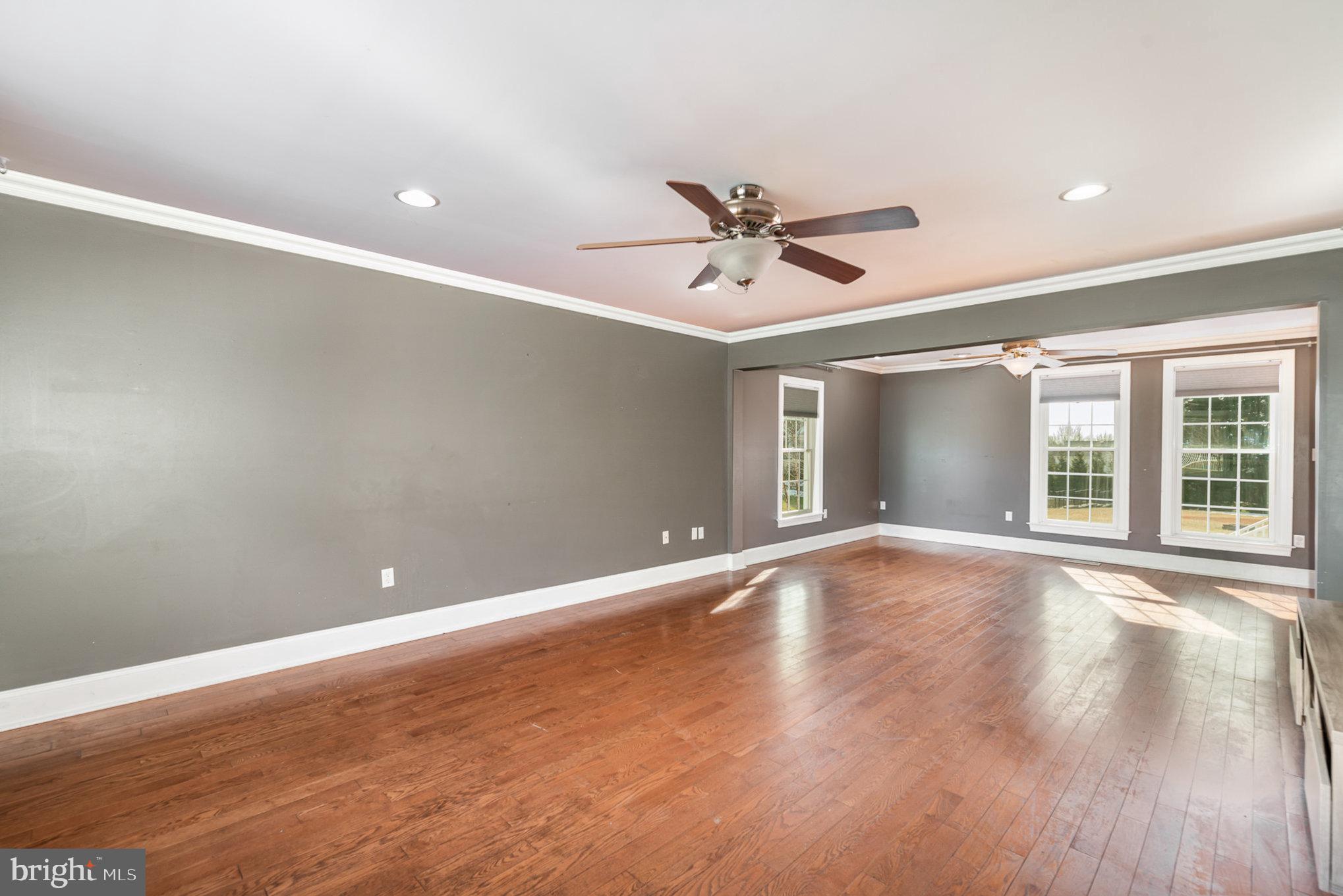 4617 Forge Road Perry Hall, MD 21128 - Photo 11 of 44 a view of an empty room with a window and wooden floor