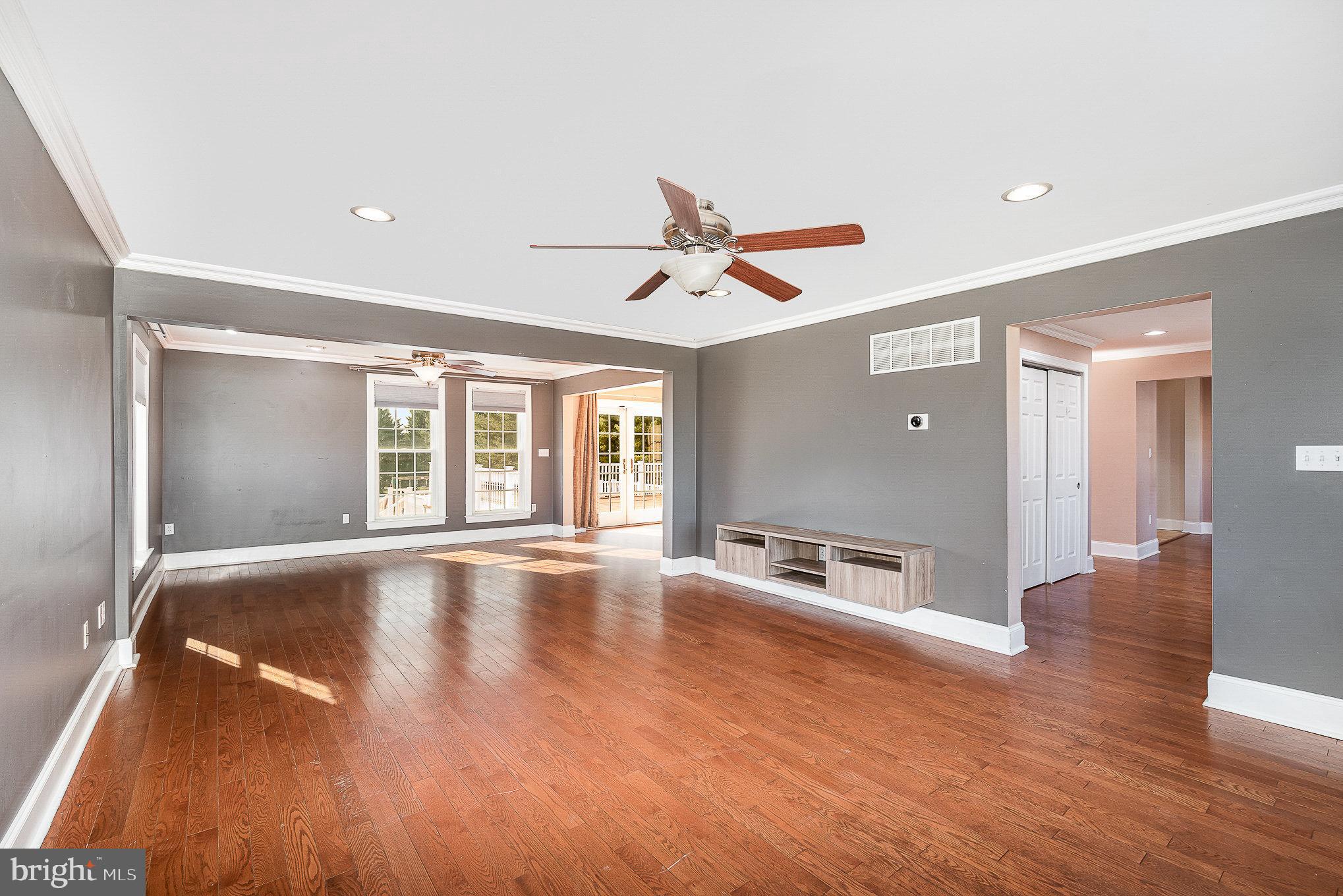 4617 Forge Road Perry Hall, MD 21128 - Photo 12 of 44 a view of an empty room with window and wooden floor