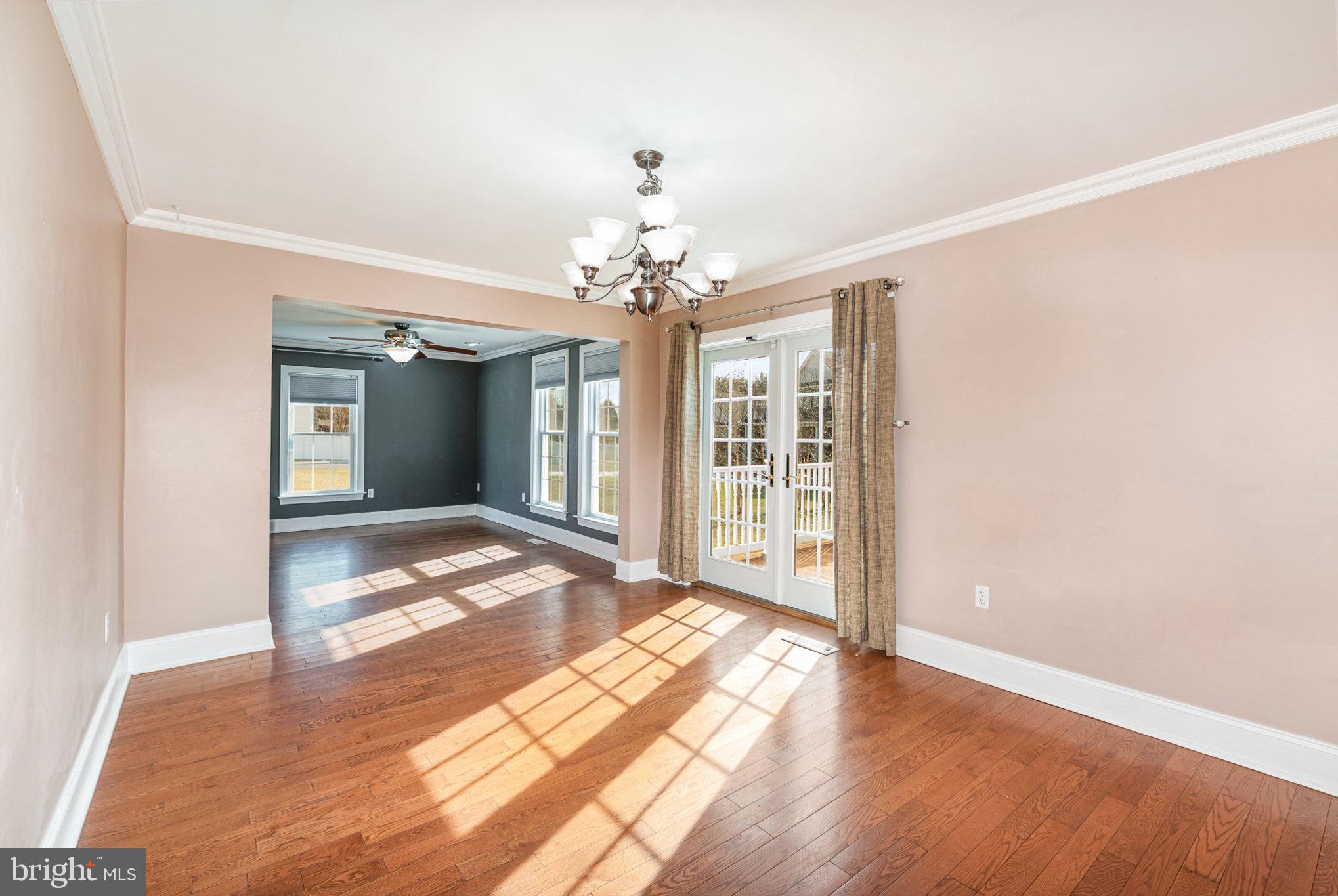 4617 Forge Road Perry Hall, MD 21128 - Photo 13 of 44 a view of an empty room with wooden floor and a window