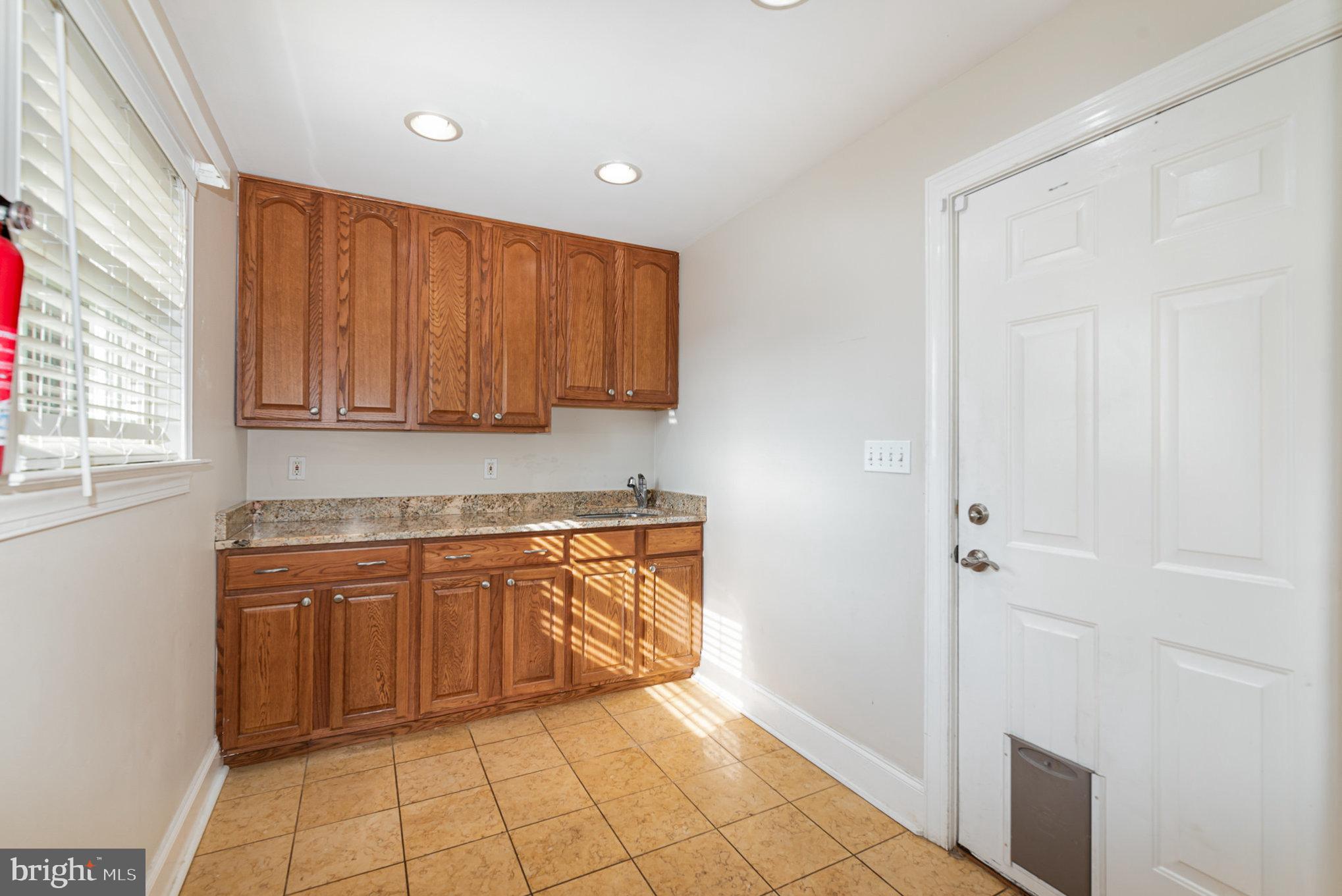 4617 Forge Road Perry Hall, MD 21128 - Photo 19 of 44 a kitchen with stainless steel appliances granite countertop a refrigerator and a sink