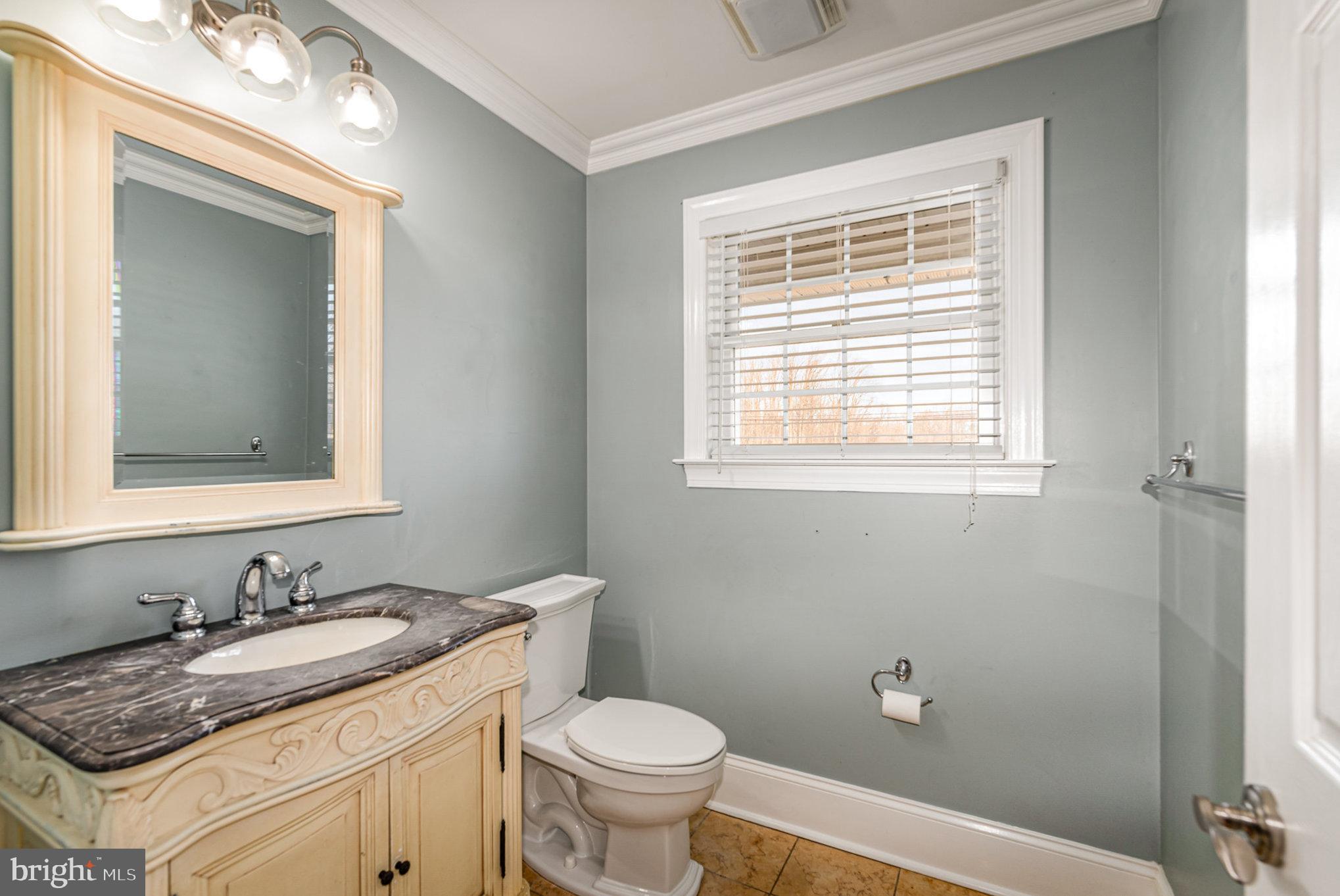4617 Forge Road Perry Hall, MD 21128 - Photo 20 of 44 a bathroom with a granite countertop sink toilet and mirror