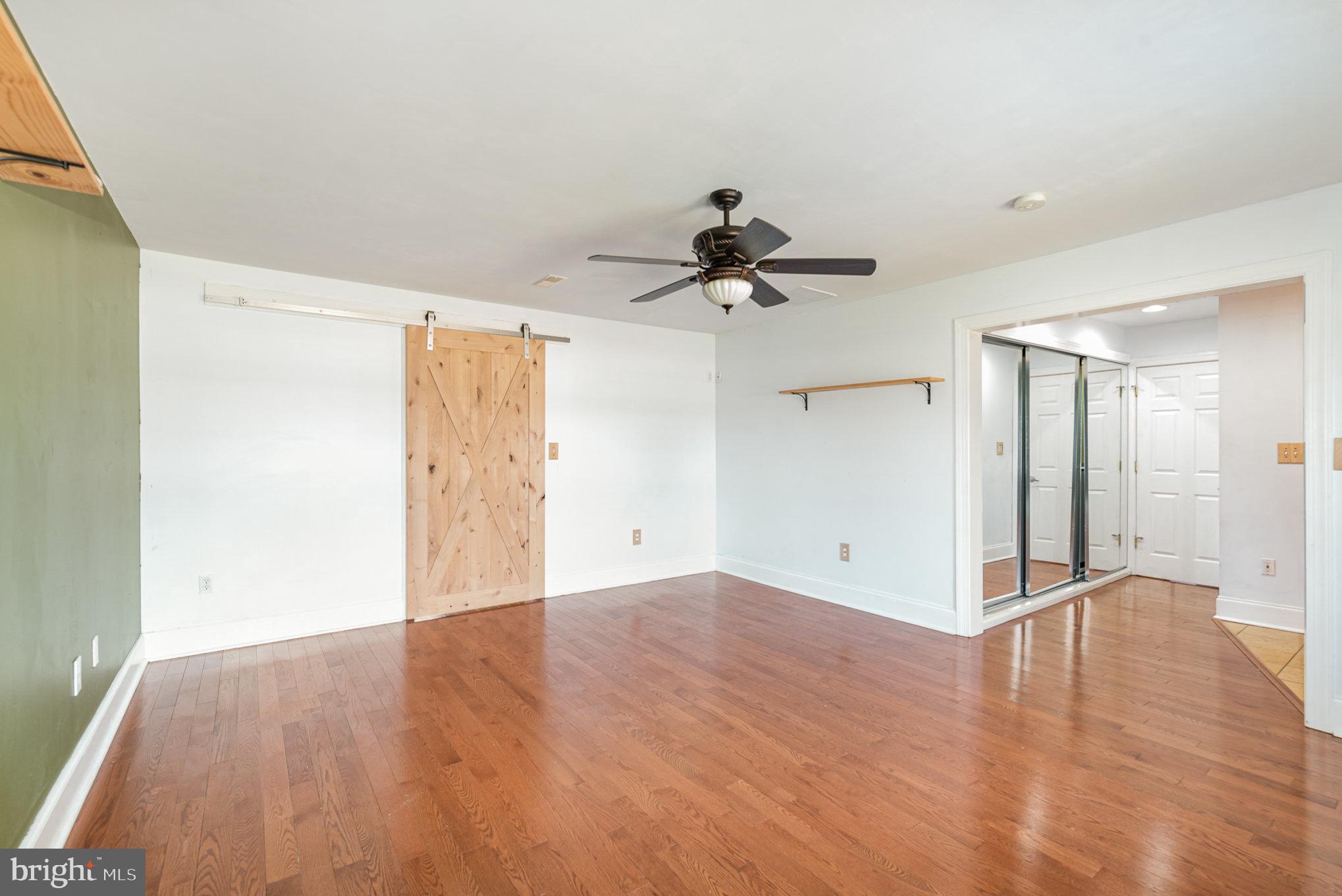 4617 Forge Road Perry Hall, MD 21128 - Photo 23 of 44 a view of a room with wooden floor and a ceiling fan