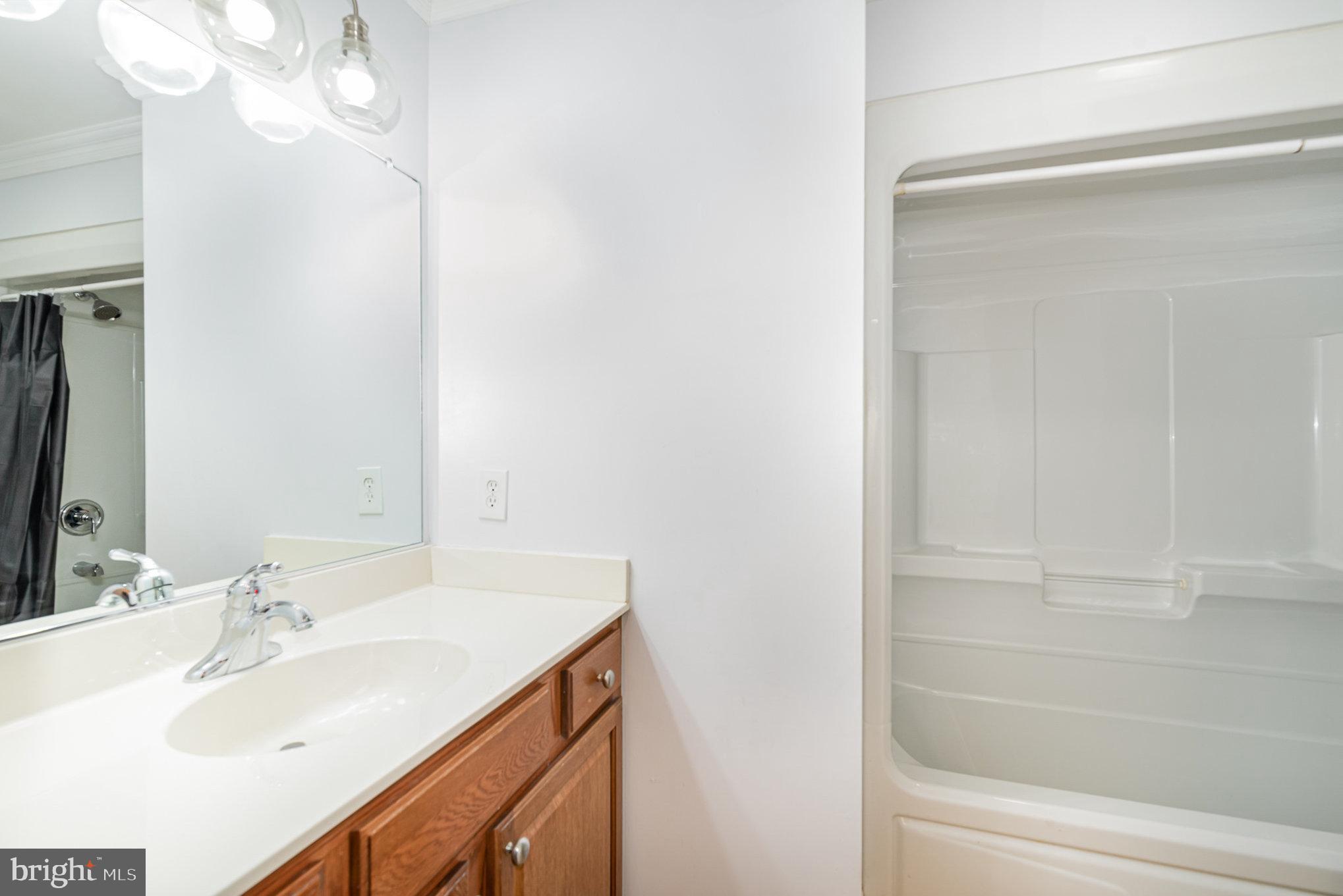 4617 Forge Road Perry Hall, MD 21128 - Photo 30 of 44 a bathroom with a sink and a mirror
