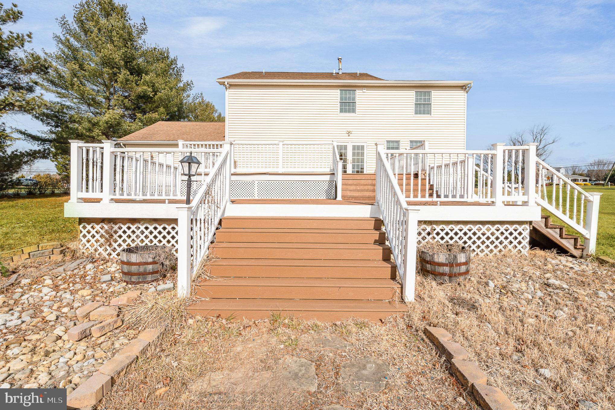 4617 Forge Road Perry Hall, MD 21128 - Photo 37 of 44 a view of a brick house with wooden floor and fence