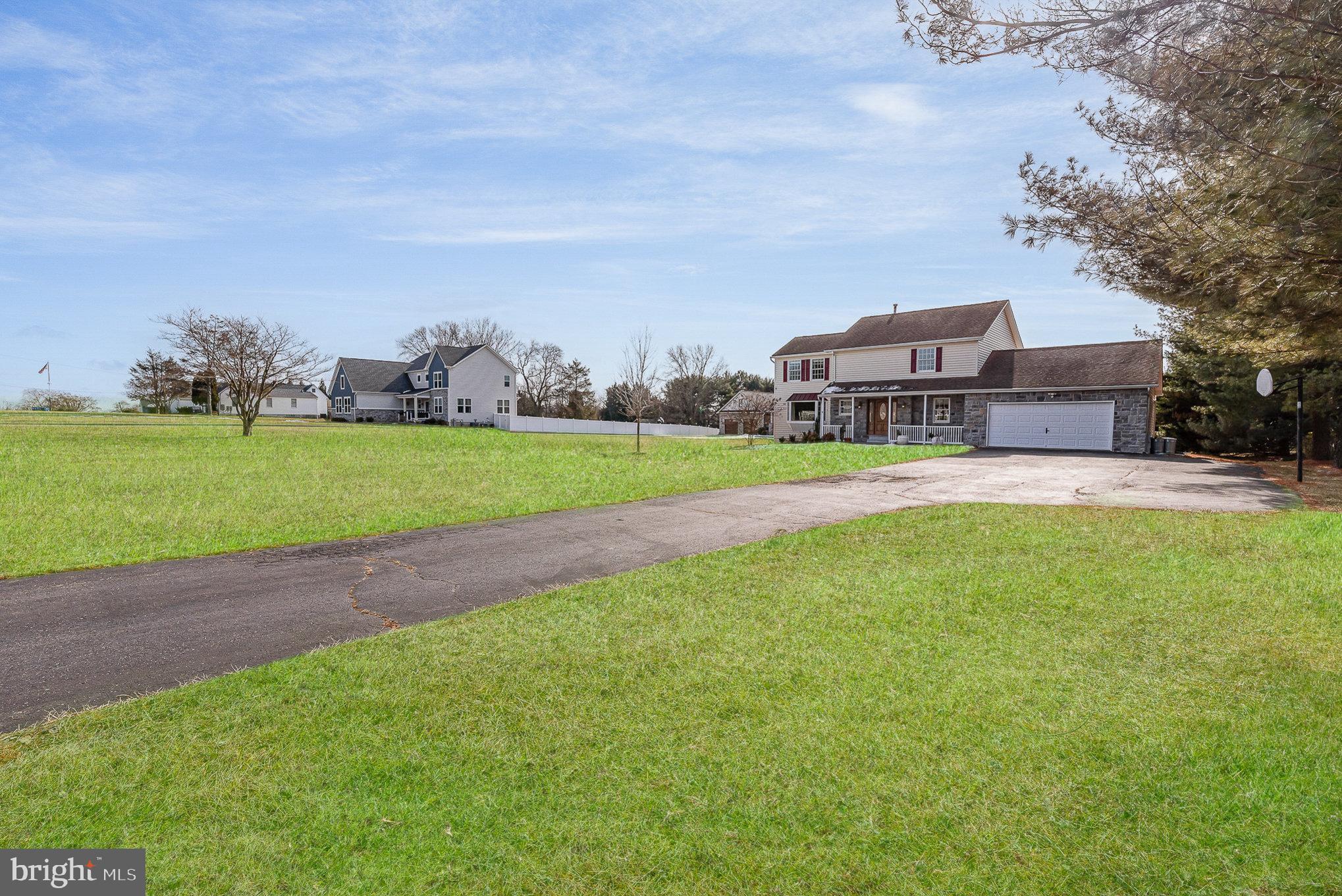 4617 Forge Road Perry Hall, MD 21128 - Photo 4 of 44 a view of a big yard with a house in the background